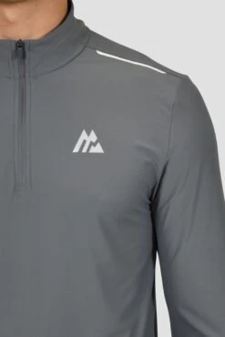 Charge 2.0 1/4 Zip - Cement Grey 11 Charge 2.0 1/4 Zip - Cement Grey -Montirex CHARGE 2.0 1 4 ZIP CEMENT GREY logo
