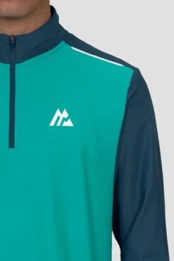 Charge 2.0 1/4 Zip - Aruba/Abyssal -Montirex Charge 1 4 Zip LAPIS SAILOR BLUE Logo close up Inc reflective detail and Zip